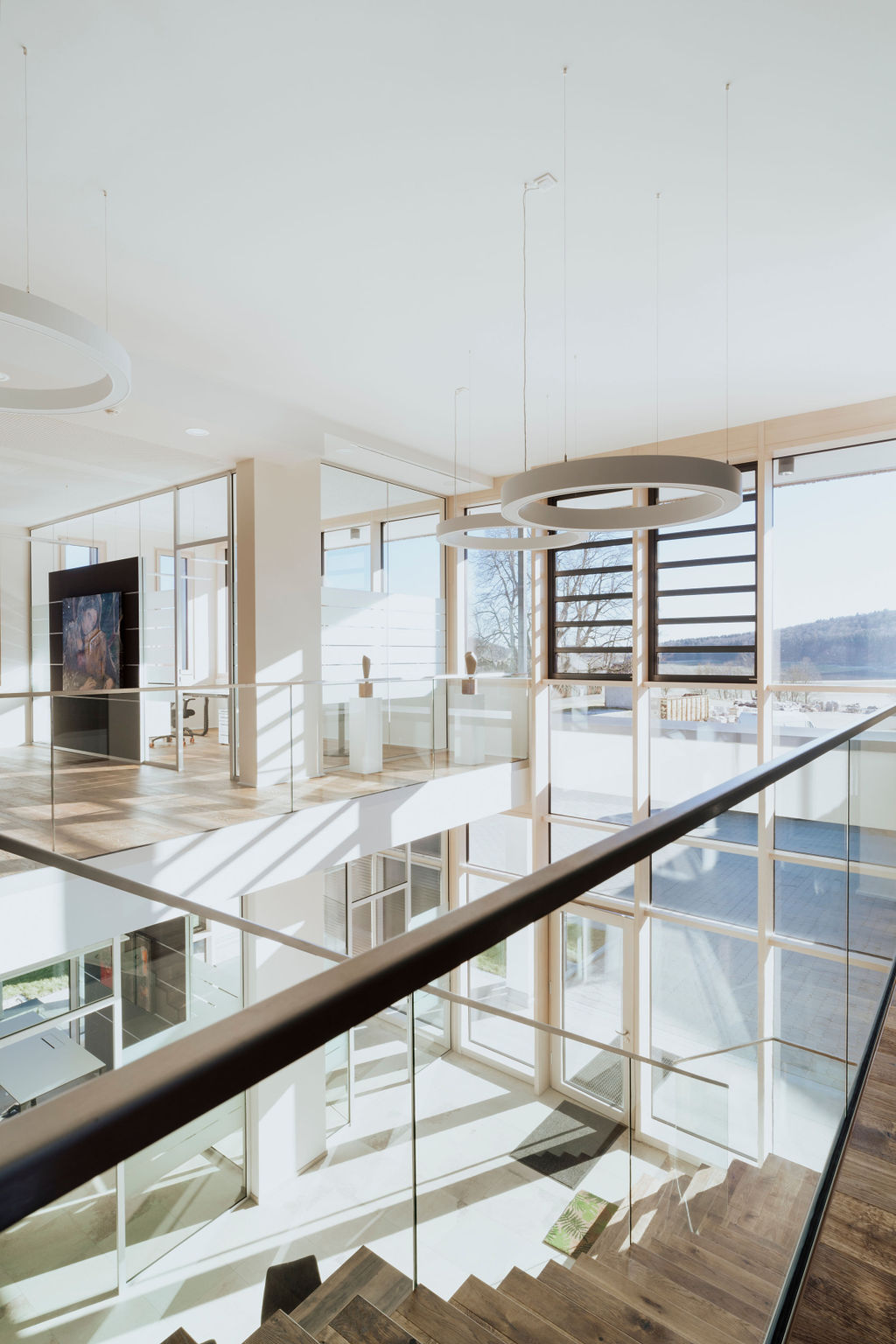 Interior Photography of a building with sun coming through large glass windows