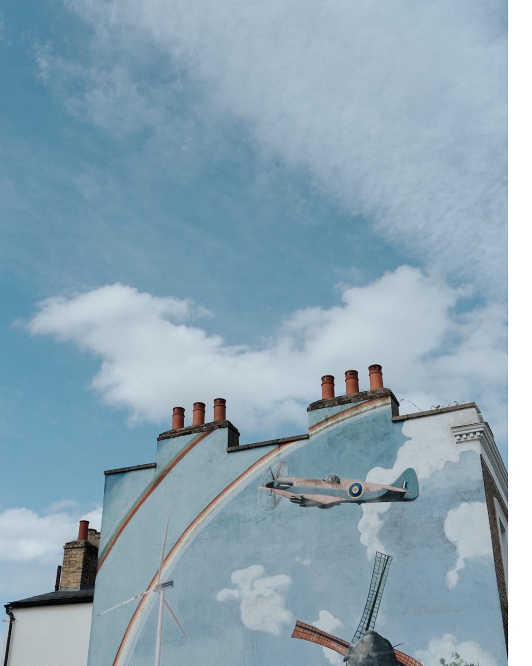 wallart in Peckham London against blue skies