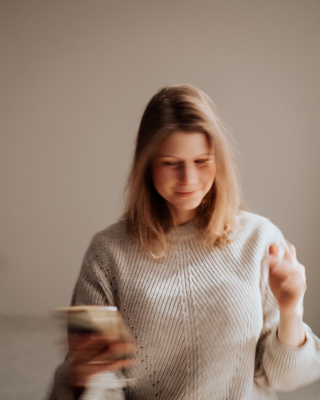 woman celebrating over phone call when the right client says yes