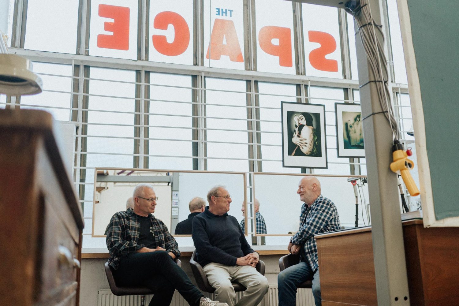 Graham Cann, Patrick Barr and Ben Hole sitting in the photostudio the Space in Southend