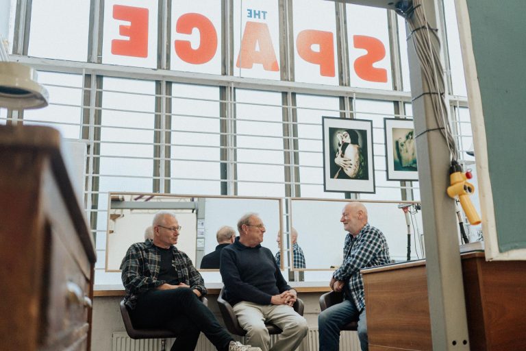 Graham Cann, Patrick Barr and Ben Hole sitting in the photostudio the Space in Southend