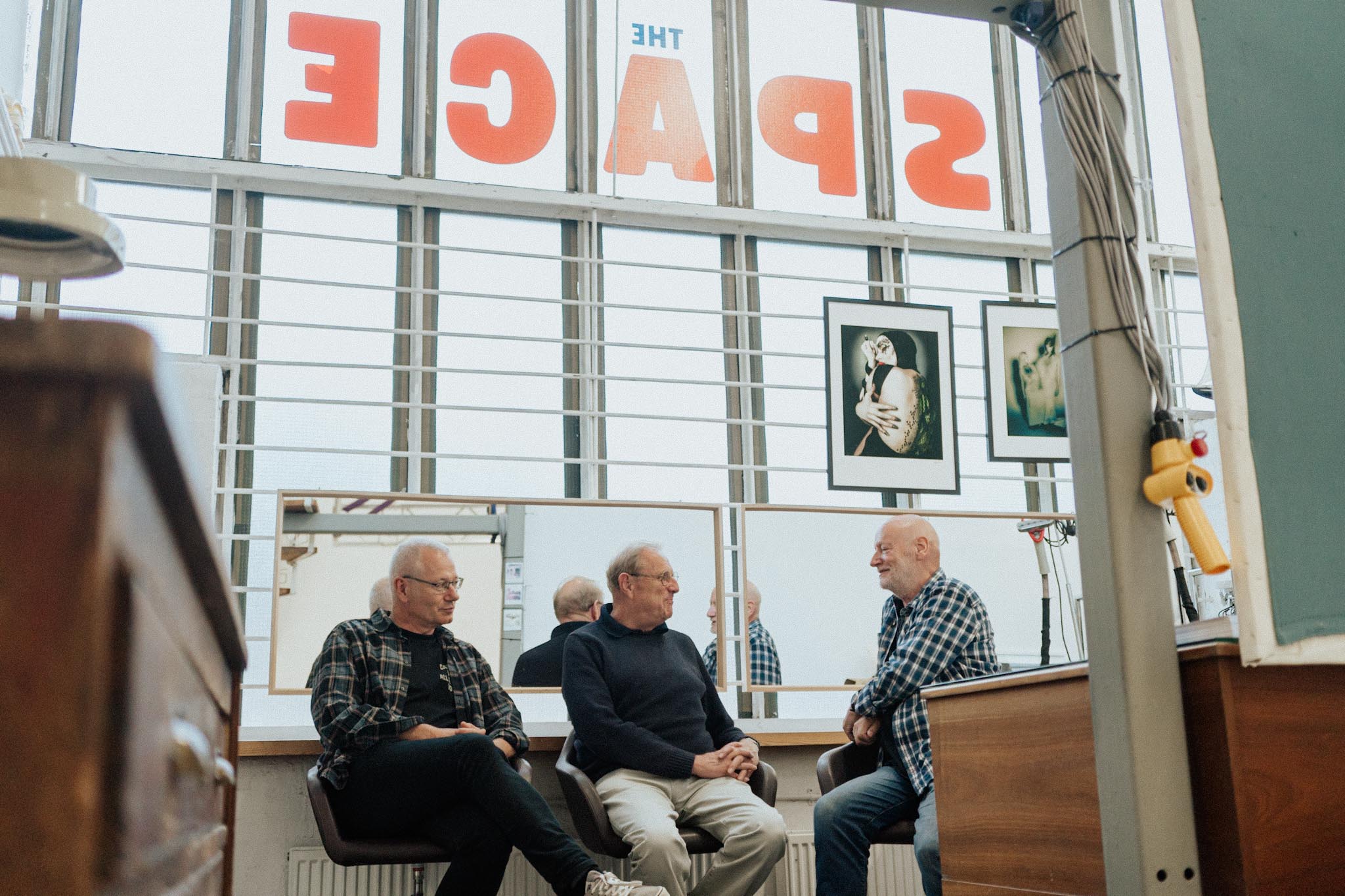 Graham Cann, Patrick Barr and Ben Hole sitting in the photostudio the Space in Southend