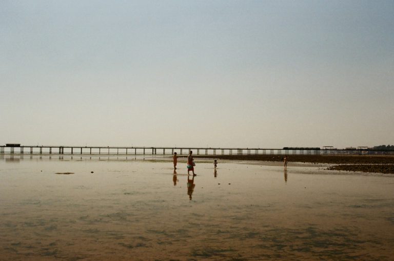 Southend on Sea beach at tide people walking