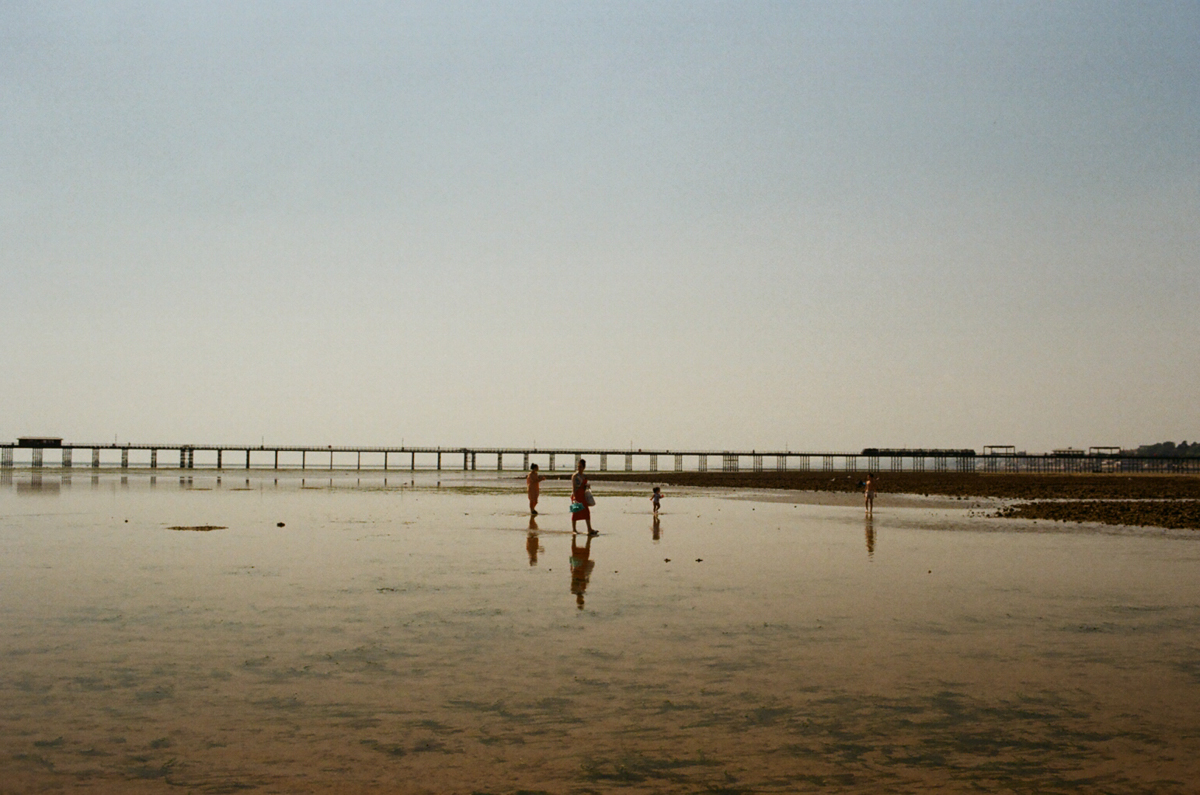 Southend on Sea beach at tide people walking