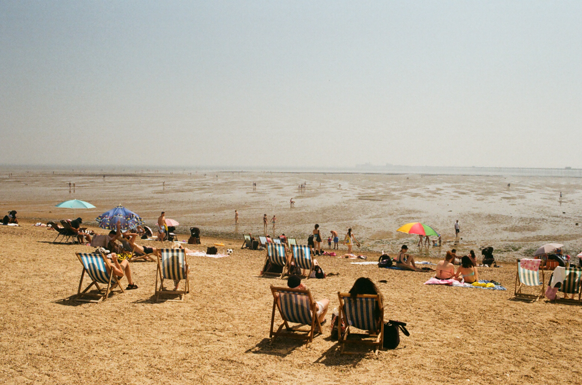 Southend on Sea beach at tide people on the beach sunbathing
