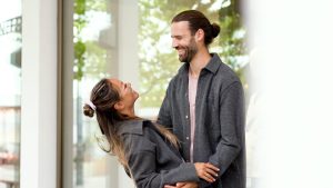 Couple in love meeting and hugging and laughing
