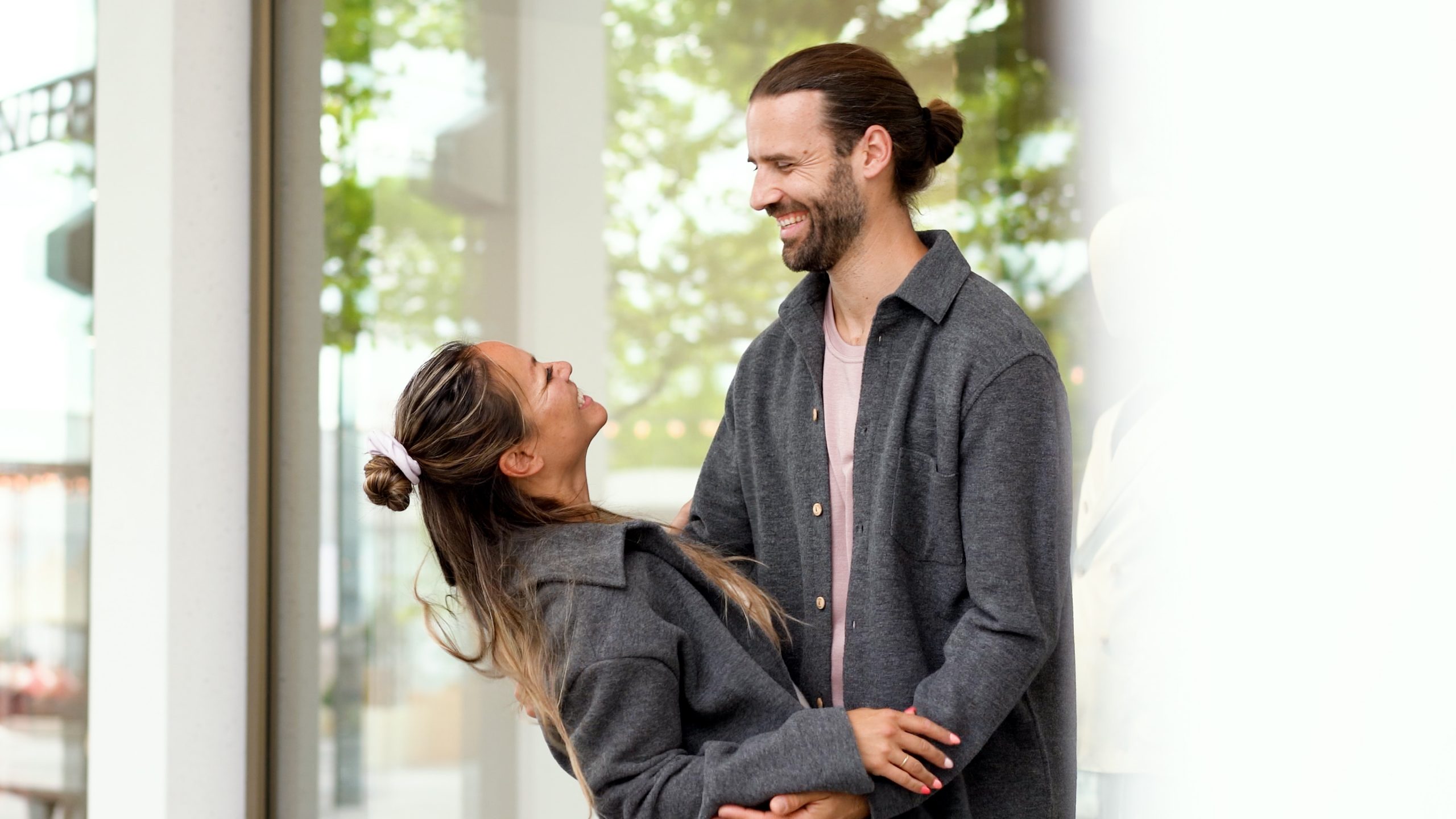Couple in love meeting and hugging and laughing