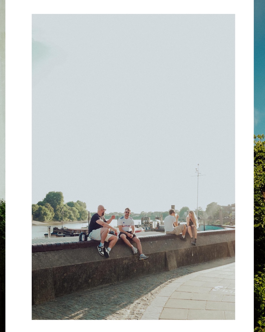 people sitting by the water at Hammersmith Riverside London