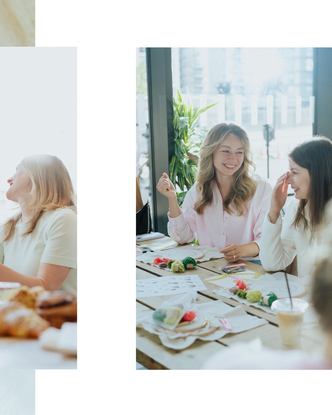 A group of women dressed in soft pastel clothing sitting around a cafe table, laughing and crafting together.